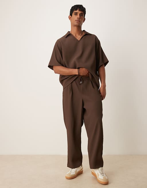 ASOS DESIGN relaxed tapered plisse jogger with pleats in brown