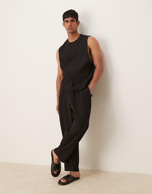 ASOS DESIGN Relaxed Tapered Plisse Joggers In Black