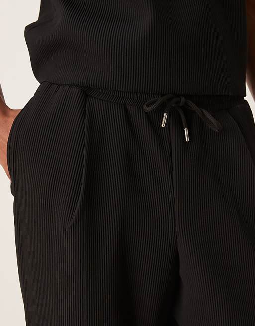 ASOS DESIGN Relaxed Tapered Plisse Joggers In Black
