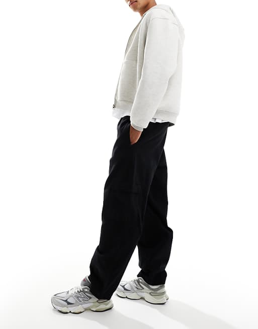 ASOS DESIGN relaxed tapered pull on cargo trousers in black with pleats