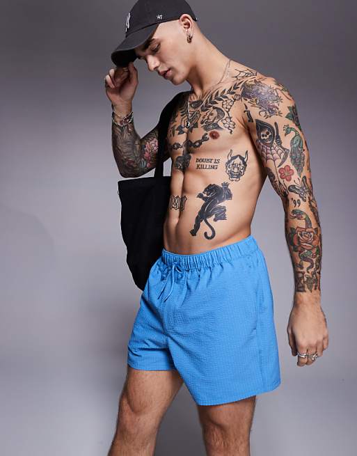 ASOS DESIGN seersucker swim shorts in short length in blue