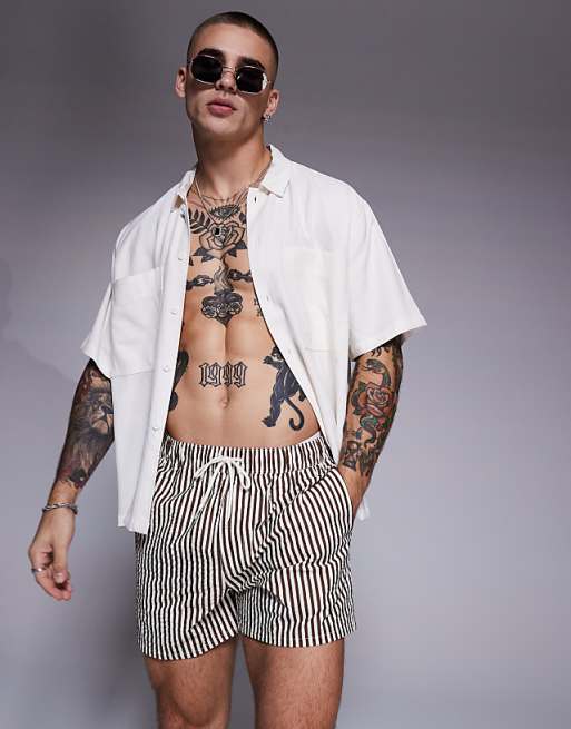 ASOS DESIGN seersucker swim shorts in short length in brown stripe