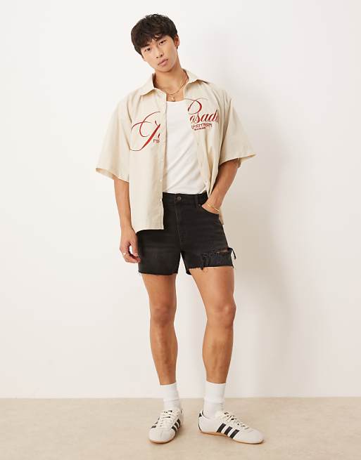 ASOS DESIGN shorter length straight fit denim shorts with rip detail in black wash