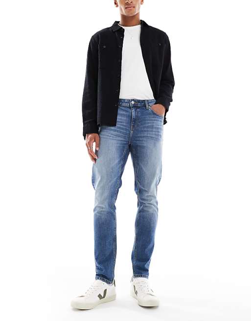 ASOS DESIGN skinny jeans in mid wash blue