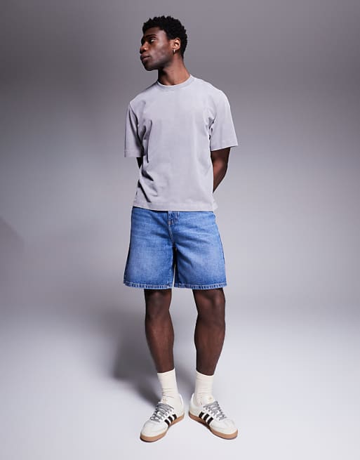 ASOS DESIGN standard length denim jort in mid wash blue