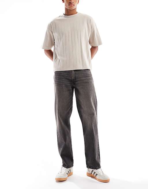 ASOS DESIGN straight fit jeans with yellow tint in washed black