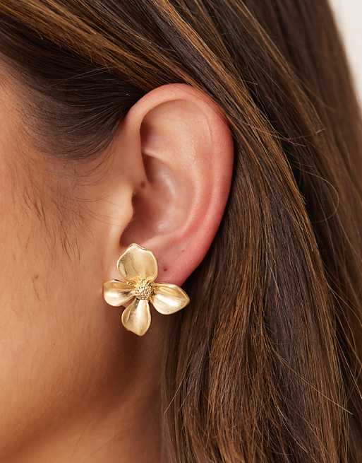 ASOS DESIGN stud earrings with small floral design in worn gold tone