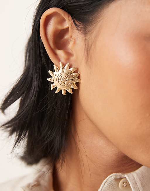 ASOS DESIGN stud earrings with sun design in gold tone