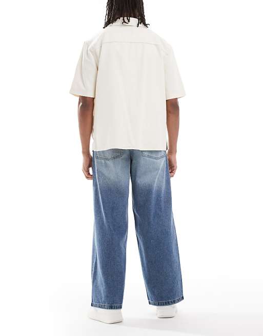 ASOS DESIGN Super Baggy Fit Jeans In Mid Wash Blue With Tint