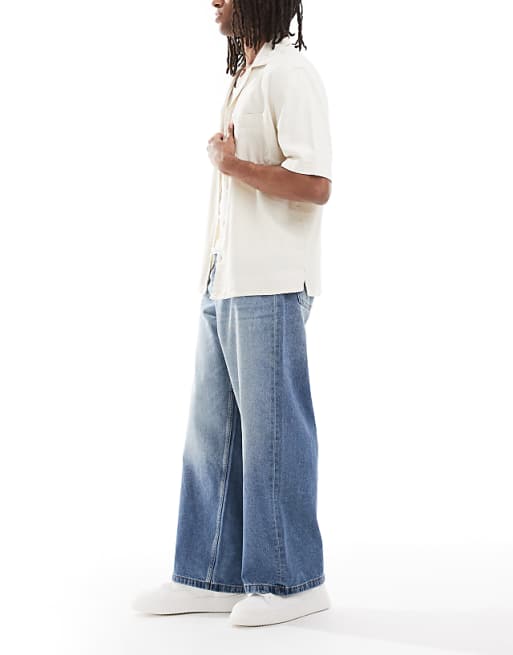 ASOS DESIGN Super Baggy Fit Jeans In Mid Wash Blue With Tint