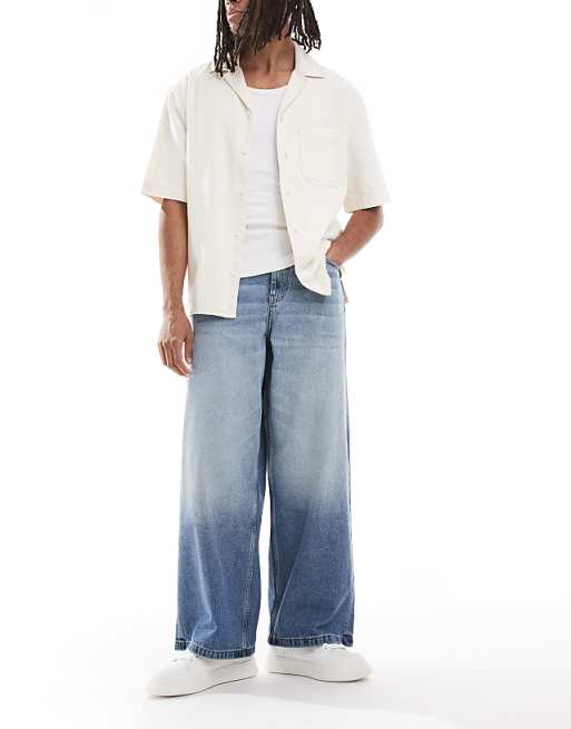 ASOS DESIGN super baggy fit jeans in mid wash blue with tint