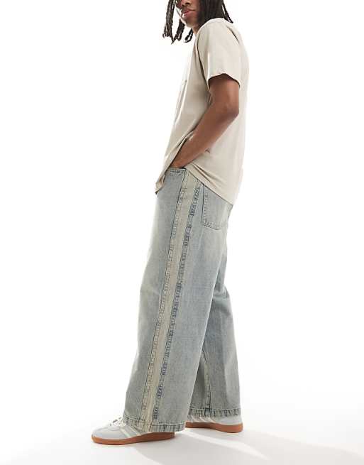 ASOS DESIGN Super Baggy Jeans With Side Panel In Yellow Tint Light Wash Blue