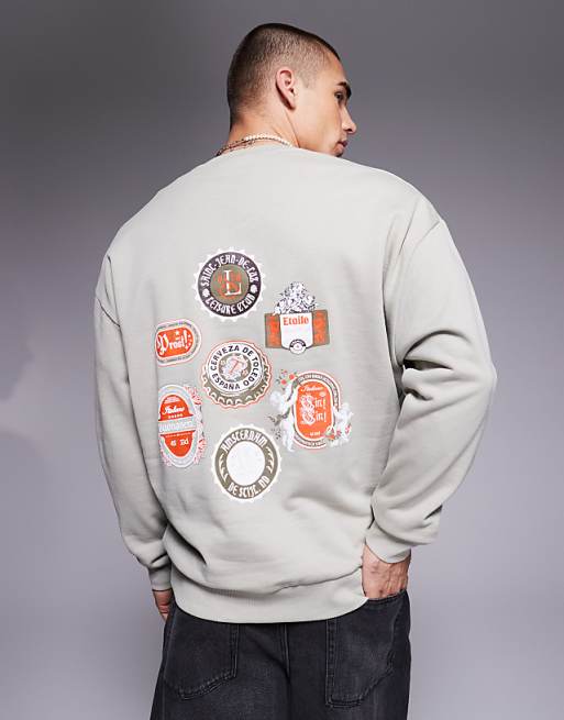 ASOS DESIGN sweatshirt with beer mat prints in grey
