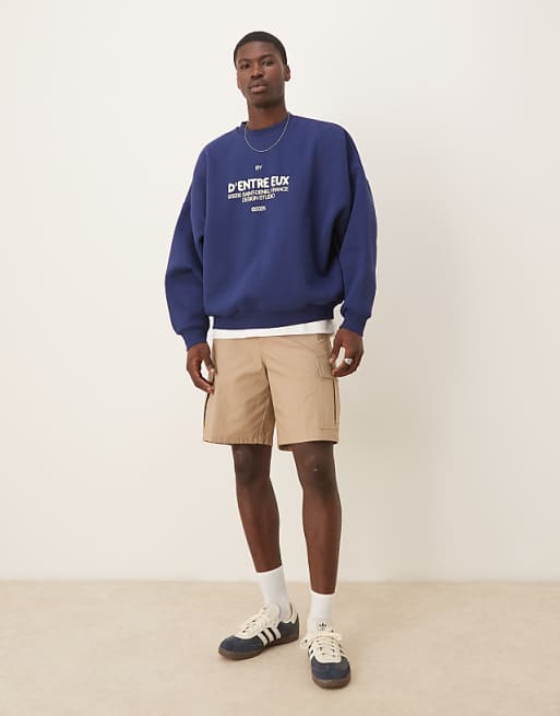 ASOS DESIGN Sweatshirt With Chest Print In Navy