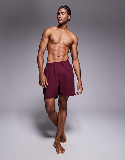 ASOS DESIGN swim shorts in long length in burgundy