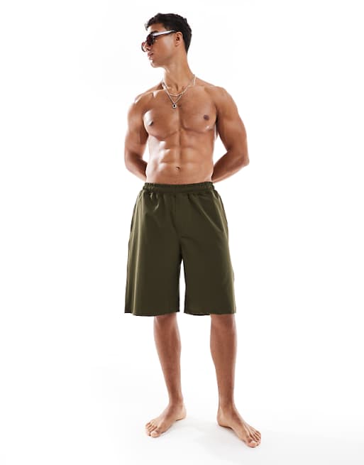 ASOS DESIGN swim shorts in long length in green