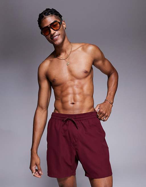 ASOS DESIGN swim shorts in mid length in burgundy