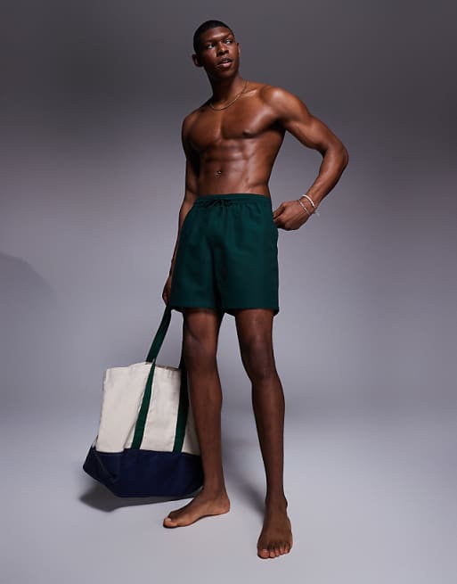 ASOS DESIGN swim shorts in mid length in dark green