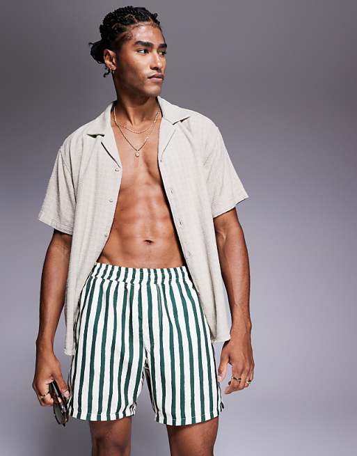 ASOS DESIGN swim shorts in mid length in green stripe