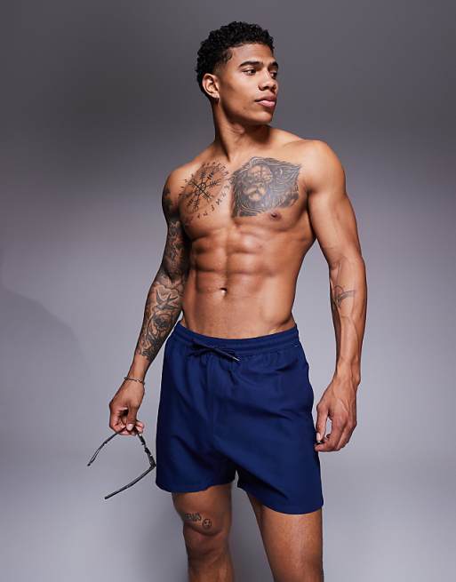 ASOS DESIGN swim shorts in mid length in navy