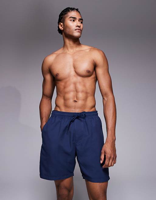 ASOS DESIGN swim shorts in mid length in navy