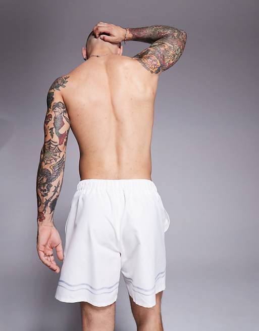 ASOS DESIGN Swim Shorts In Mid Length In Stone With Border Print