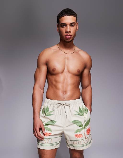 ASOS DESIGN swim shorts in mid length with placement print in beige
