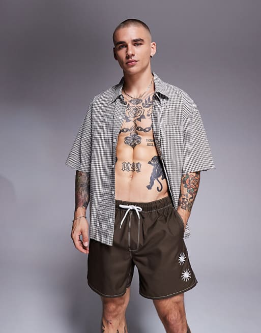 ASOS DESIGN swim shorts in mid length with sun embroidery in brown