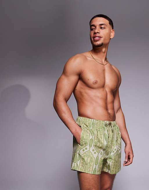 ASOS DESIGN swim shorts in short length in green paisley print