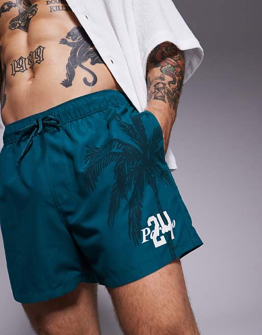 ASOS DESIGN swim shorts in short length in green