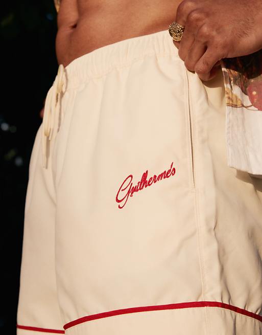 ASOS DESIGN Swim Shorts In Short Length In Neutral With Placement Embroidery