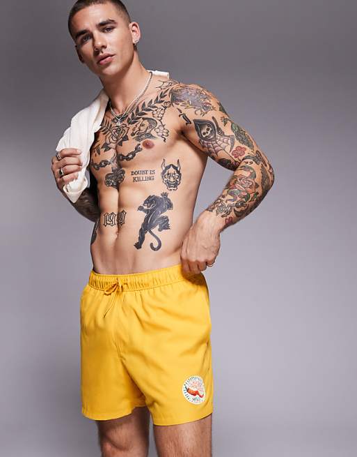 ASOS DESIGN swim shorts in short length in yellow