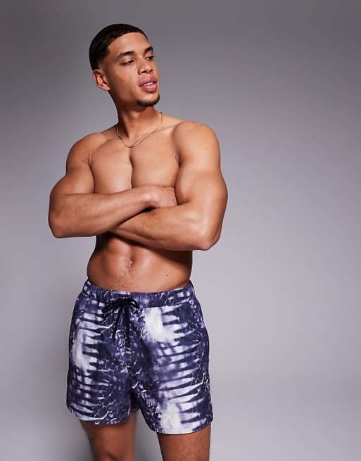 ASOS DESIGN swim shorts in short length with animal print in navy