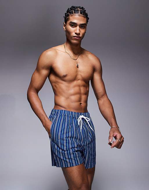 ASOS DESIGN swim shorts in short length with blue stripe