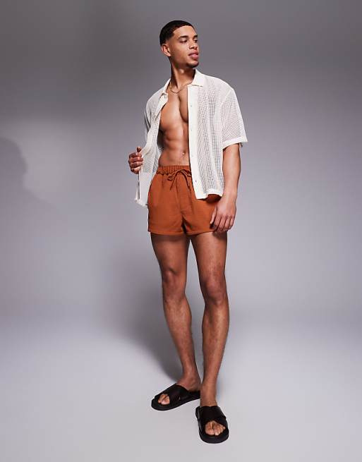 ASOS DESIGN swim shorts in super short length in orange