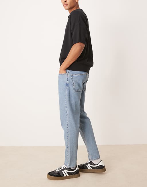 ASOS DESIGN Tapered Fit Jeans In Light Wash Blue