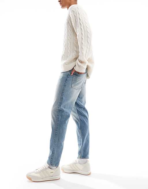 ASOS DESIGN Tapered Fit Jeans In Light Wash Blue