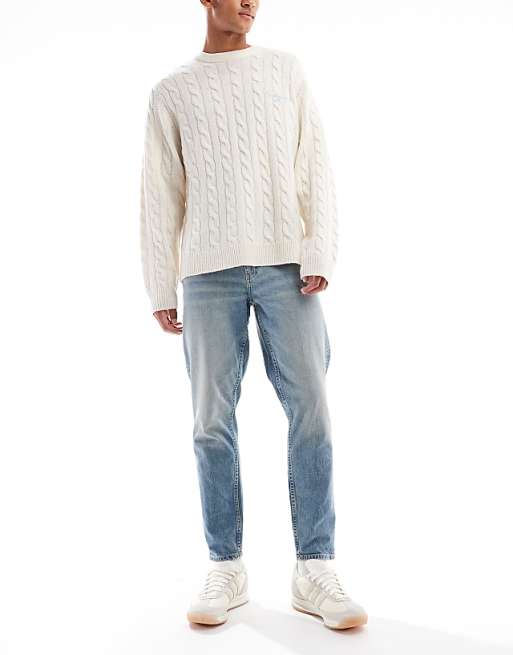 ASOS DESIGN tapered fit jeans in light wash blue