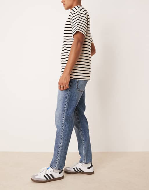 ASOS DESIGN Tapered Fit Jeans In Mid Wash Blue