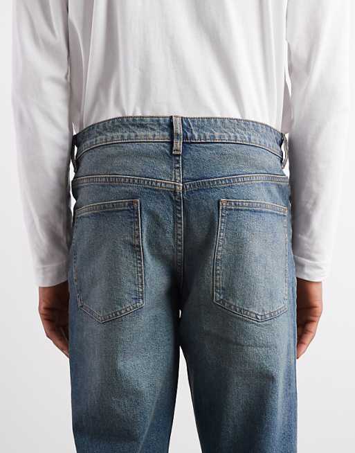 ASOS DESIGN Tapered Fit Jeans With Tint In Mid Wash Blue
