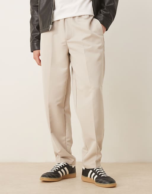 ASOS DESIGN tapered fit smart trousers with elasticated waistband in stone