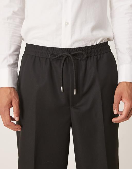 ASOS DESIGN Tapered Fit Trouser With Elasticated Waist And Cuffs In Black