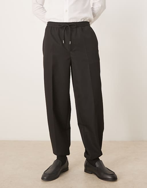 ASOS DESIGN tapered fit trouser with elasticated waist and cuffs in black