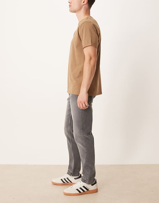 ASOS DESIGN Tapered Jeans In Black Wash