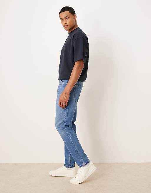 ASOS DESIGN Tapered Jeans In Mid Wash