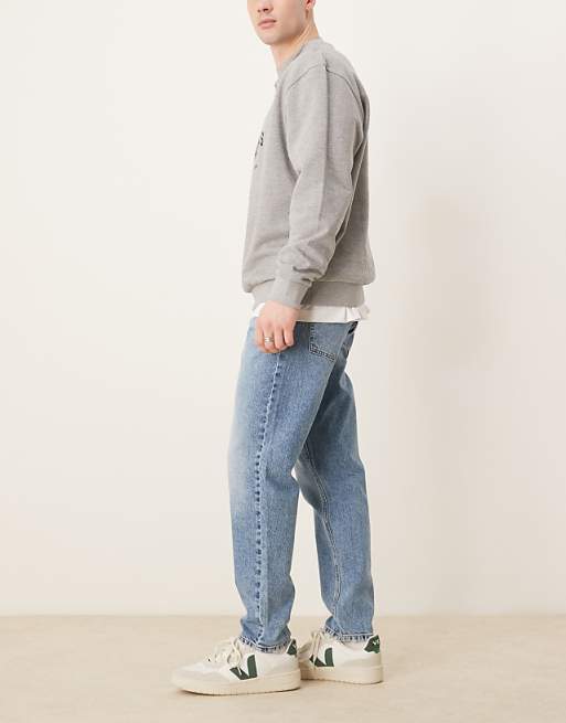 ASOS DESIGN Tapered Jeans In Mid Wash Blue
