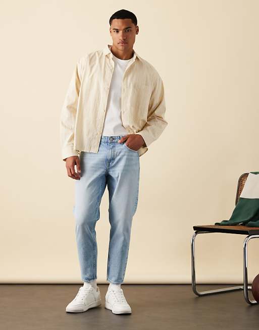 ASOS DESIGN tapered jeans in mid wash blue