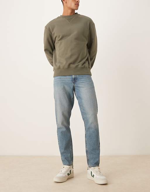ASOS DESIGN tapered jeans in mid wash blue