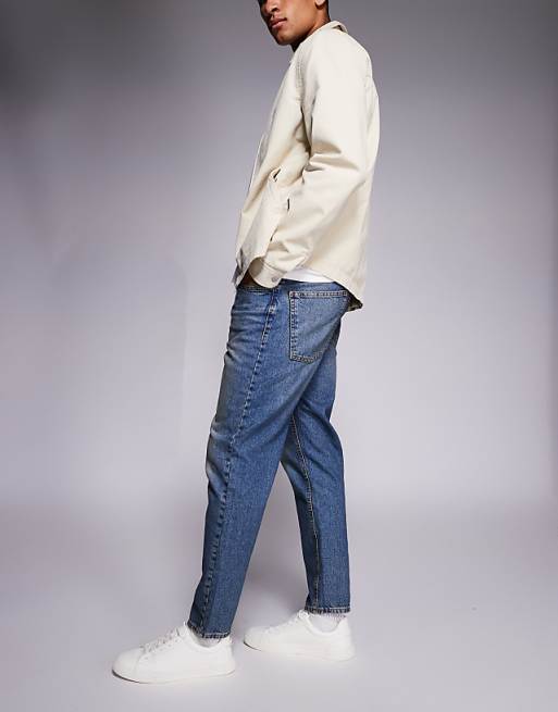 ASOS DESIGN Tapered Jeans In Mid Wash With Tint
