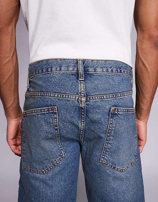 ASOS DESIGN Tapered Jeans In Mid Wash With Tint